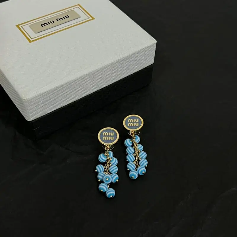 miu miu boucles doreilles pour femme s_12240531